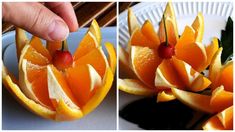 there are oranges cut in half and placed on a plate with cherries attached to them