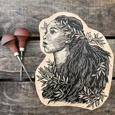 an image of a woman's head with leaves on it and some wood carving tools