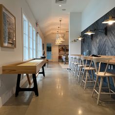 a long table and chairs in a room