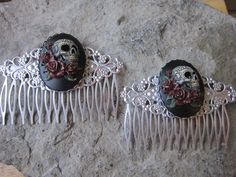 "Beautiful pair of hand painted skull and roses cameo hair combs, choose silver or bronze. The cameo is amazingly detailed and with gorgeous colors, each is individually hand painted and antiqued, please feel free to message me with a custom color. I have many similar styles so please do browse my shop. The filigree hair combs are very pretty and about 3\" long, please see the photos. I have an enormous selection of cameos you can choose from for a custom order, so please do browse my shop, and Sand Jewelry, Painted Skull, Jewelry Matching, Skull And Roses, Hair Comb Accessories, Formal Gloves, Tie Necklace, Goth Wedding, Skull Painting