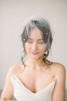 a woman wearing a veil over her head