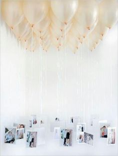 an instagram page with balloons and photos hanging from the ceiling, which are attached to strings