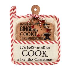 a wooden ornament with an image of a ginger cookie in it's pocket