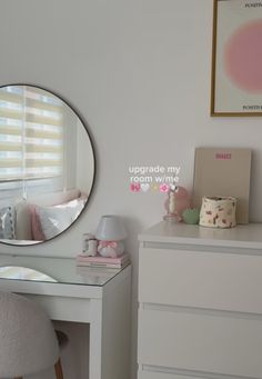 a white desk with a mirror, chair and other items on it in a room