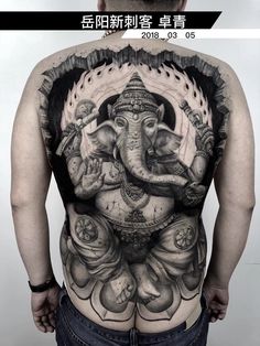 the back of a man with an elephant tattoo