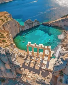 an aerial view of the ruins and surrounding water