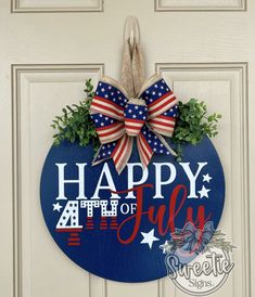 a patriotic door hanger with the words happy fourth of july and an american flag bow