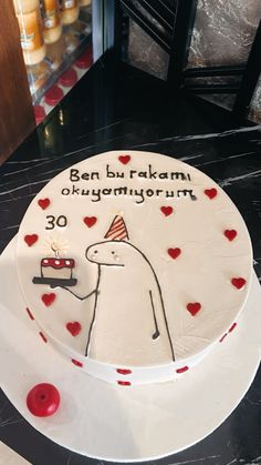 a birthday cake decorated with an image of a man holding a car