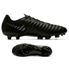 a pair of black soccer shoes next to an image of the shoe in front of it