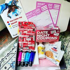 the contents of a date night coupon are displayed in a box on a bed