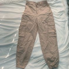 Abercrombie Pants Size Xs Tan Pockets On The Side (Cargo Style Pants) New With Tags Synched By The Ankle High Waisted Beige Cargo Bottoms With Long Pants, Beige Long Pants With Cargo Pockets, Beige Parachute Pants For Spring, Fitted Full Length Beige Cargo Pants, Beige Cargo Bottoms, Beige Utility Full-length Bottoms, Spring Beige Cargo Pants With Belt Loops, Beige Cargo Pants With Belt Loops For Spring, Beige Cargo Long Pants