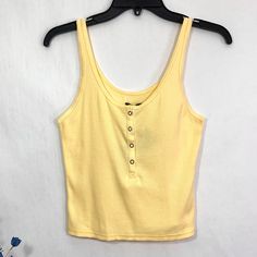 New To Poshmark? Use Code Happyoutfit To Save $10 On Your First Purchase! Wild Fable Women's Straw Yelllow / Pastel Yellow Ribbed Snap Placket Sleeveless Tank Top. Size: Medium Pit To Pit: 14" Unstretched - 20" Stretched Length: 19" Condition: New With Tags Cheap Seamless Yellow Tank Top, Yellow Cami Tank Top, Yellow Retro Sleeveless Tank Top, Super Cropped Top, Yellow Sleeveless Seamless Crop Top, Polo Crop Top, Forever 21 Yellow Sleeveless Top, White Crop Top Tank, Spaghetti Strap Crop Top