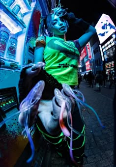 a woman in neon green and black is dancing on the street with her hands behind her back