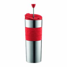 a red and silver cup with a straw sticking out of it's side on a white background