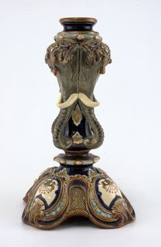 an ornately decorated vase is shown against a white background