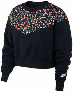 A daisy-fresh remix of a classic look, this slightly cropped sweatshirt from Nike remasters the Windrunner lines with a vibrant floral print. Loose fit INSPIRED FOR: Athleisure Fleece Crewneck; logo at left sleeve Shell: cotton/polyester; overlay: polyester; rib: cotton/spandex Machine washable Nike Sportswear Women, Tops Nike, Nike Crewneck, Nike Pullover, Nike Sweater, Nike Sweatshirts, Cropped Sweatshirt, Crop Top Sweater, Womens Fleece