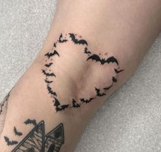 a person with a bat tattoo on their arm