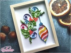 an ornament made out of paper with fruit