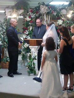 the bride and groom are getting married at the alter