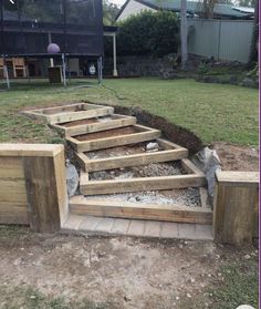 wooden steps leading up to the back yard