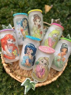 there are many princesses painted on the glass bottles in this basket, and one is for sale