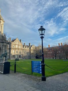 a lamp post in front of a large building