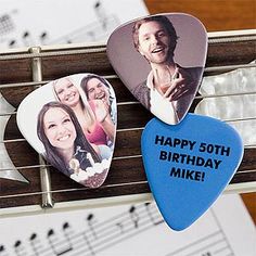 three guitar picks with the words happy 30th birthday mike on them and music notes in front of them