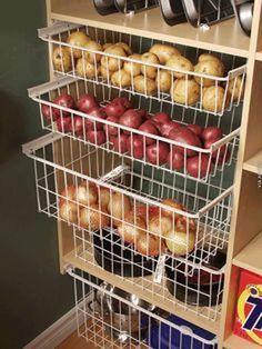 the shelves are filled with apples and other foods