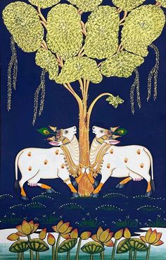 two cows standing in front of a tree with flowers on it's branches, under a blue sky