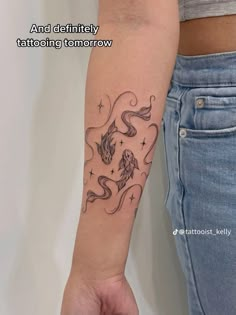 a woman with a tattoo on her arm