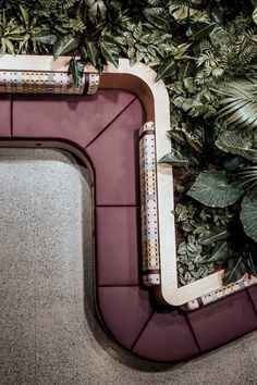 an overhead view of a building with plants growing on the wall