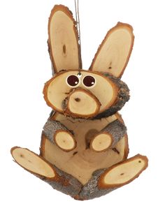 a wooden bunny ornament hanging from a string