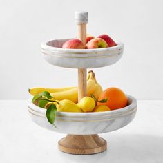 two tiered trays with fruit on them