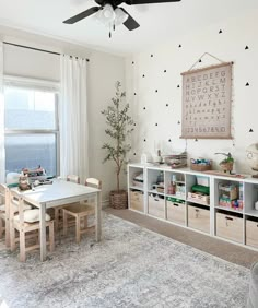 a child's playroom with toys, bookshelves and other items in it