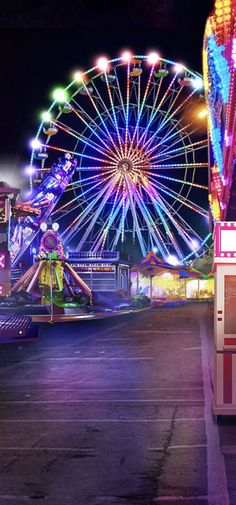 an amusement park at night with ferris wheel and carnival rides in the background, lit up by brightly colored lights