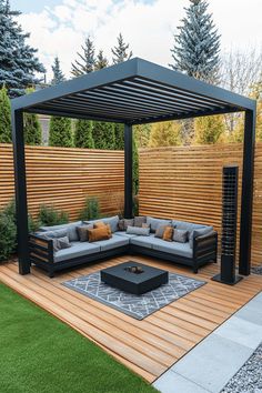 an outdoor living area with couches, tables and a fire pit in the middle