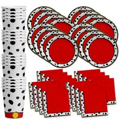 red and white polka dot party supplies including plates, cups, napkins and more