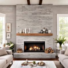 a living room filled with furniture and a fire place in the middle of a fireplace