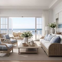 a living room filled with furniture next to an open door and ocean front view window