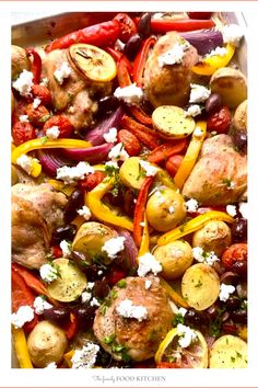 chicken and vegetables with feta cheese on top in a baking dish, ready to be eaten