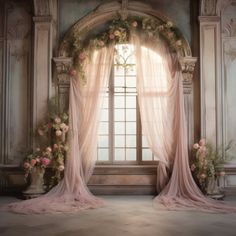 an open window with sheer curtains and flowers