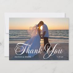 a wedding thank card with the words thank you on it and a photo of two people kissing