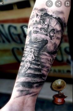 a person with a clock tattoo on their arm