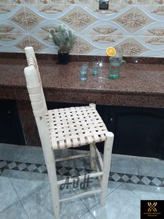 a white chair sitting in front of a counter