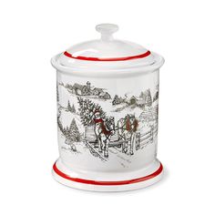 a white and red cookie jar with a horse drawn carriage on it's lid