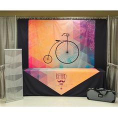 a photo booth set up for an event with a bicycle on the front and back