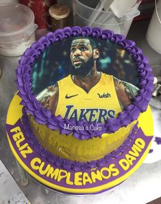 a birthday cake with a photo of the los angeles lakers's lebron davis on it