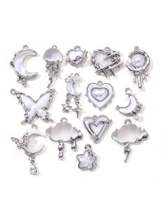 a bunch of charms sitting on top of a white surface