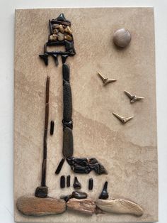 an assortment of objects are displayed on a piece of paper that has been made into a sculpture