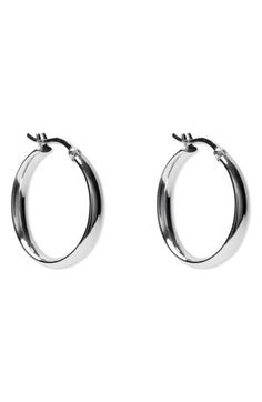 Whether made from sterling silver or sterling silver plated in 18-karat gold, these high-shine hoop earrings are the perfect accessories to take your look to the next level. 1" hoop diameter; 1/4" width Snap-post closure Sterling silver or sterling silver/18k-gold plate Imported Earrings Hoops Silver, Silver Hoops Aesthetic, Silver Hypoallergenic Hoop Earrings, Silver Hypoallergenic Metal Hoop Earrings, Everyday Sterling Silver Tarnish-resistant Hoop Earrings, Hoops Aesthetic, Silver Tarnish-resistant Sterling Silver Hoop Earrings, Nickel-free Silver Alloy Hoop Earrings, Keep Jewelry